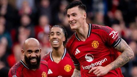 Manchester United striker Benjamin Sesko (right) celebrates his goal against Sunderland at Old Trafford