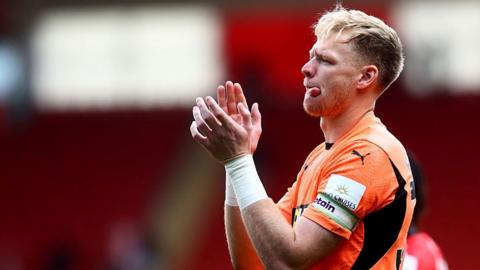 Aaron Ramsdale applauds the fans
