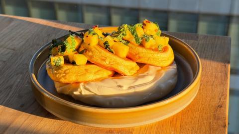 Fluffy pancakes with pineapple, lime, Greek yoghurt and hot honey.