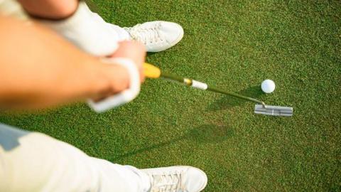 Generic photo of a person playing golf