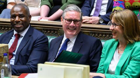 Keir Starmer smiling in the house of commons 
