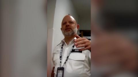 Police officer raises hand