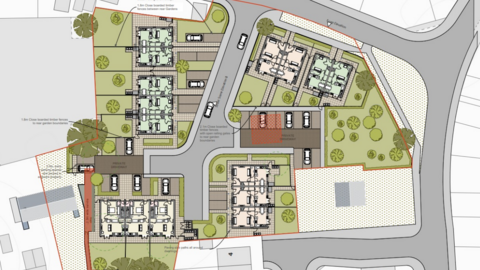 A plan of a proposed housing development with roads marked in grey, surrounding houses in white and the new buildings in colour, with green gardens around them