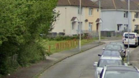 A Google maps image shows Channel Park Avenue in Plymouth with cars parked along one side and an area of grass and trees on the other