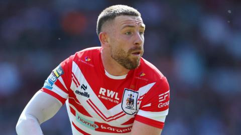 Jackson Hastings preparing to throw a pass during St Helens' game with Castleford