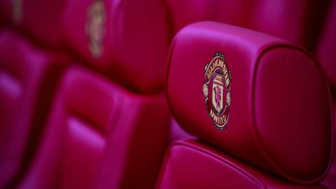 Close up of Manchester United dugout seat with badge