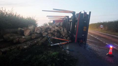 Lorry with shed load of logs on A617