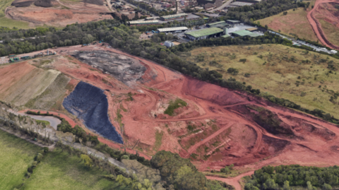 An aerial shot Highfields Waste Disposal Site showing dirt and green fields surrounding the site.