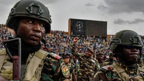 General Abdourahamane Tiani (C), the head of the military regime in Niger, greets the thousands of people who gathered at the largest stadium in Niamey for the launch of festivities marking the first anniversary of his coming to power after the July 26, 2023 coup that overthrew civilian president Mohamed Bazoum on July 26, 204