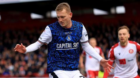 George Saville playing for Luton against Stevenage