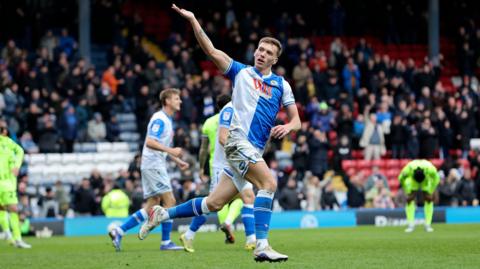 Hayden Carter celebrates with his hand aloft after scoring for Blackburn Rovers
