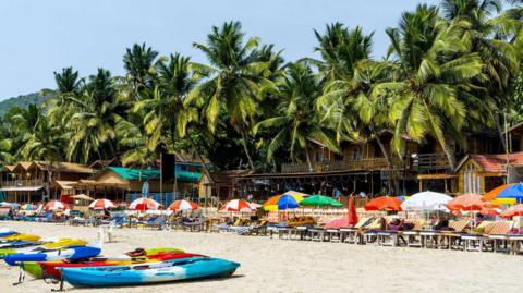 PALOLEM, 1st February 2023: Tourists enjoy sunbathing on Palolem beach of South Goa, India.