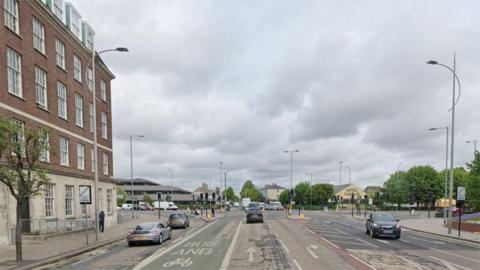 Google street view showing the stretch of Ferensway where the work will take place. There are a number of cars on the road and a bus lane marked in green. The junction with Spring Bank is visible in the distance with traffic at a standstill.