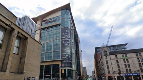An image of Cineworld Renfrew Street. It's a tall building amongst others with windows across the side we can see. There's a Cineworld sign at the top.
