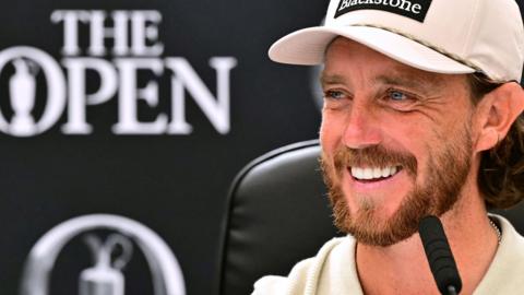 Tommy Fleetwood smiling while speaking at a news conference before the 154th Open Championship at Royal Birkdale