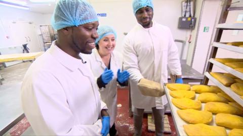 Mike from Flake Bake and a tray of Jamaican patties