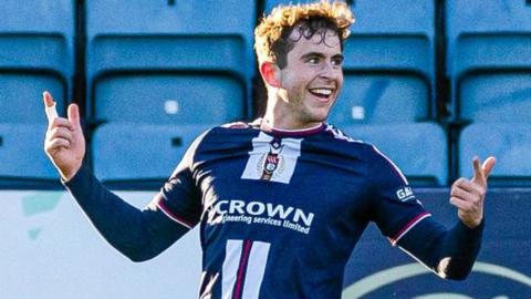 Dundee's Finn Robertson celebrates his winning oal