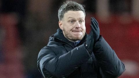 Middlesbrough head coach Kim Hellberg applauds the fans after the defeat by Hull City