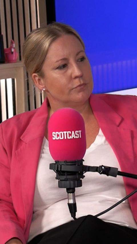 Former MP Hannah Bardell sits in front of microphone