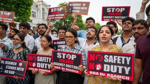 The resident doctors hold placards while chanting slogans during a protest against the brutal rape and murder of a postgraduate trainee doctor from Kolkata's RG Kar Hospital