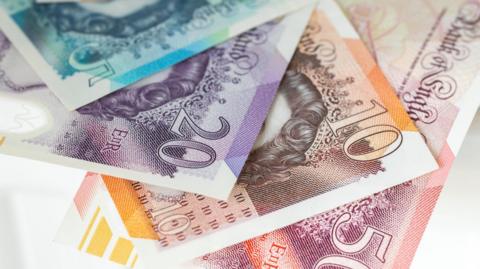 British money - five, ten and twenty pound notes in a stock picture