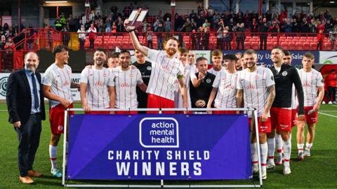 Larne celebrate winning the Charity Shield