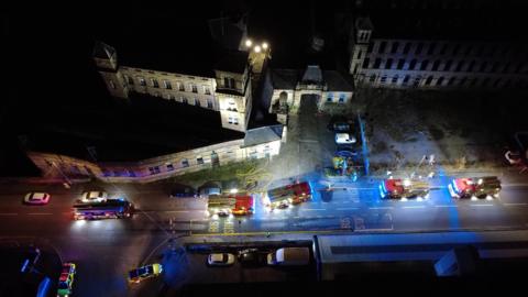 Birds eye view of Dalton Mills with emergency services around it