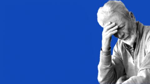 a man holding his forehead