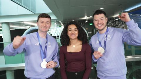Bruce and Hammy with Nina, holding up their medals