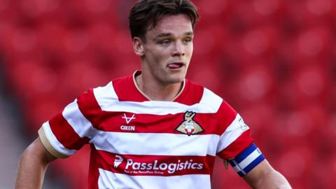 Owen Bailey in action for Doncaster Rovers in a pre-season friendly against Lincoln City