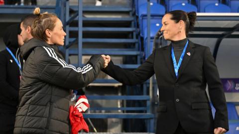 Rhian Wilkinson fist bumps with Jess Fishlock in 2024 