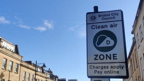 A Clean Air Zone sign on Bristol's Park Street on a sunny day