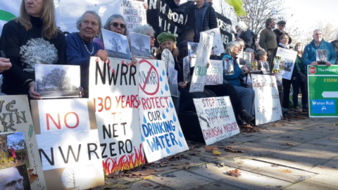 Protesters outside the meeting in October