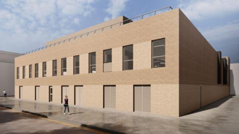 Computer generated design of what the new building may look like. A two storey high boxy building made of light brown brick lined with a row rectangular windows at its front and multiple entrances