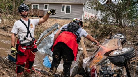 Members of the Illinois Water Rescue One team search through debris for survivors in the aftermath of Hurricane Helene in Swannanoa, North Carolina on Tuesday 2 October 2024