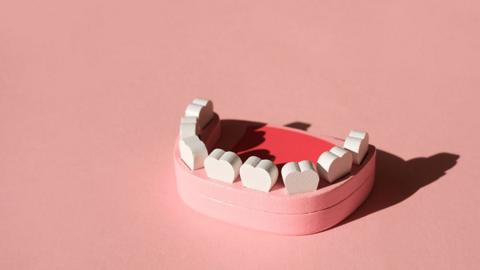 cartoon of teeth on pink background