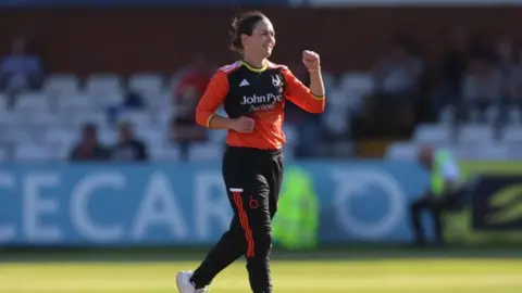 Heather Graham of The Blaze celebrates after getting Phoebe Franklin out during the Charlotte Edwards Cup Final match between South East Stars and The Blaze at The County Ground on June 22, 2024