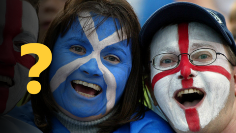 Fans at the Commonwealth Games with England flag and Scotland flag face paint