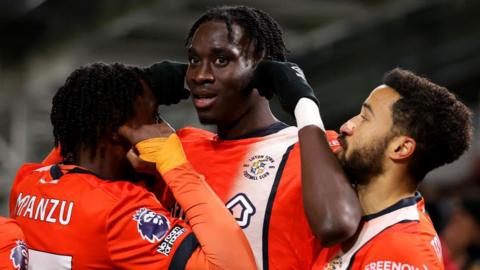 Elijah Adebayo celebrates with his team-mates