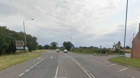 A crossroads with cars on it 