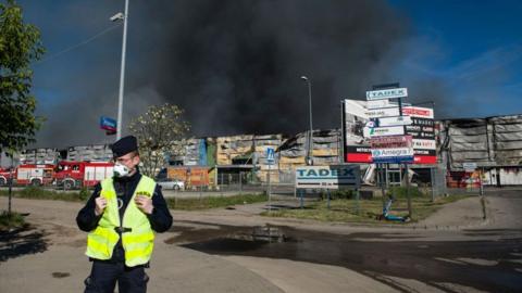 Black smoke seen in the sky above the burning Marywilska 44 shopping center in Warsaw