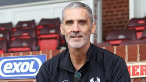Stuart Watkiss in the stands at Aggborough