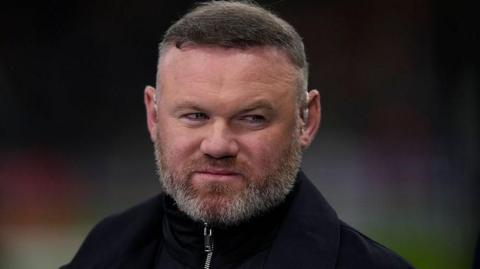 Wayne Rooney looks on