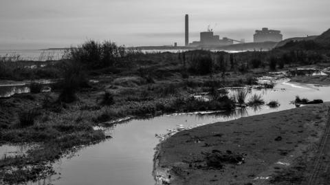 A black and white image of a power station