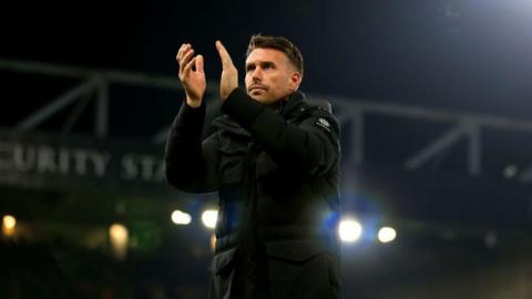 Luton Town boss Rob Edwards applauds supporters