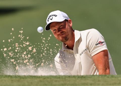 Danny Willett plays out of the bunker during the Masters second round