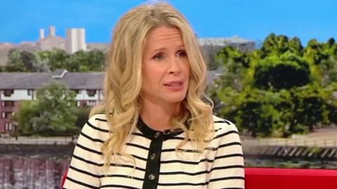 Lucy Beaumont in a pale yellow top with black stripes