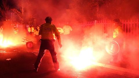 Police officers in the middle of a violent clash outside Villa Park in Birmingham