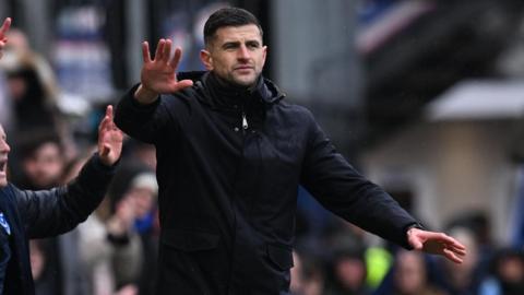 John Mousinho calls for calm from down on the touchline at Fratton Park