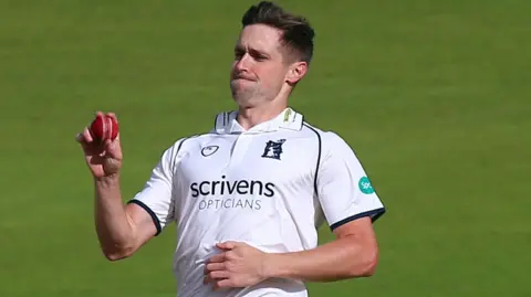 Chris Woakes bowling for Warwickshire